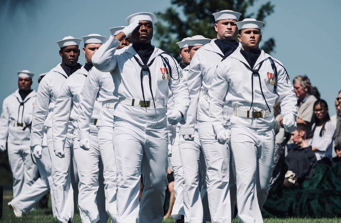 Navy ceremonial honor guard moving in formation